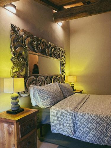 a bedroom with a bed and a large mirror at Il Fienile B&B in Guastalla