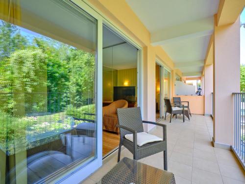 a balcony with a view of a living room at Hotel Boffenigo - The Golden Hour in Costermano sul Garda