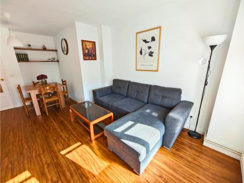 a living room with a couch and a table at Apartamento Pena Furada in Ribadeo