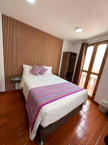 Golden Paris Hotel "Caminos del InKa 2025"にあるベッド