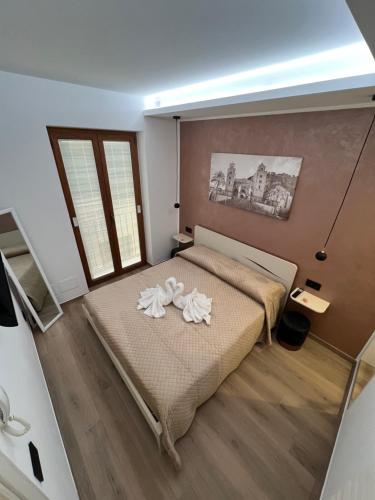 Postel nebo postele na pokoji v ubytování Ad un passo dalla Rocca luxury suite