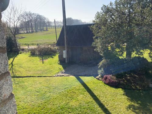 an aerial view of a yard with a building at Welcoming and peaceful bed and breakfast in Fougerolles-du-Plessis