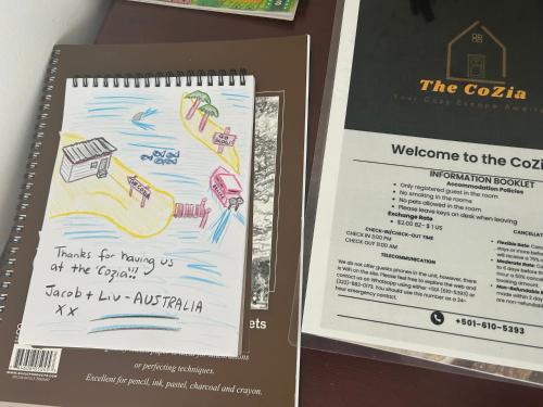 a notebook with a drawing of a kite on it at The CoZia in Belize City