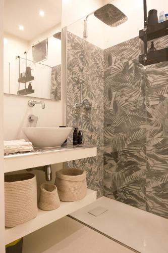 a bathroom with a sink and a mirror at La Chicca di Sant'Agata in Brescia