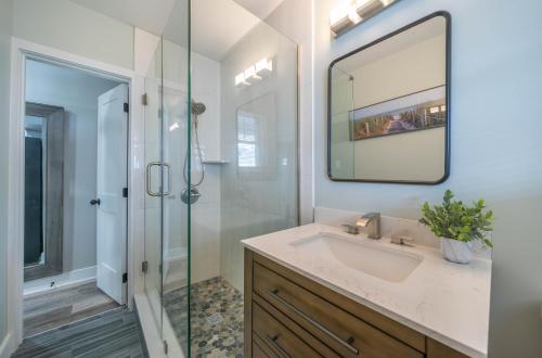 a bathroom with a sink and a glass shower at Surf Shore Properties in North Wildwood
