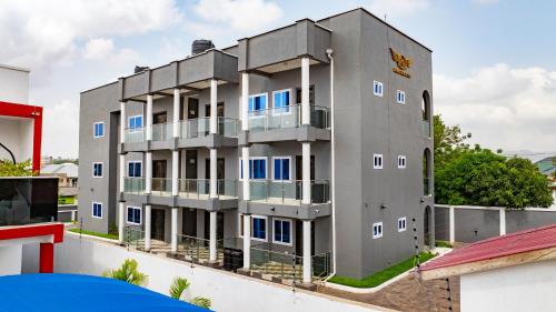 an apartment building with blue windows on a roof at RS Royal Executive Luxurious 3BR Apartment F3-3 and 2BR Apartment F3-2 in Pantang