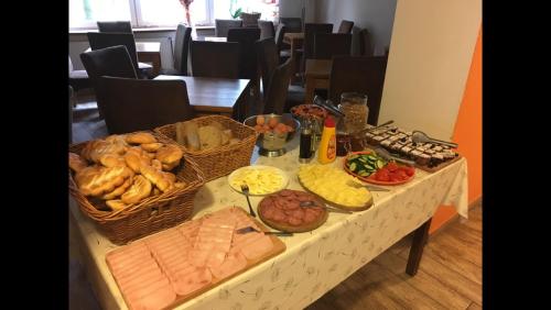 a table with many different types of food on it at Lávka 222 Chocerady in Chocerady