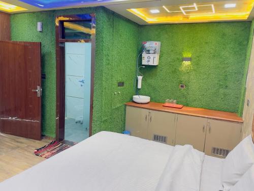 Ένα ή περισσότερα κρεβάτια σε δωμάτιο στο Kridha Home Stay1