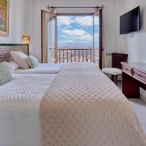 Ένα ή περισσότερα κρεβάτια σε δωμάτιο στο Hotel Mirador Arabeluj