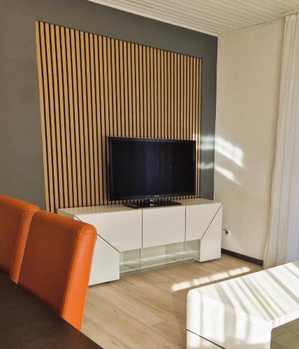 TV a/nebo společenská místnost v ubytování Sonnenschein 0L mit Terrasse und Garten