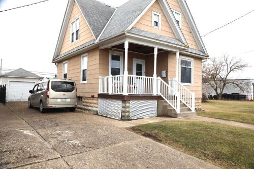 a van parked in front of a house at Werner Haus in Sandusky
