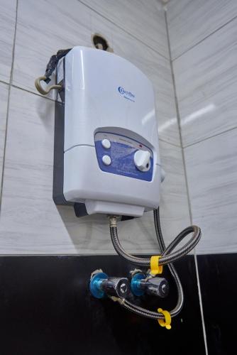 a toaster is hooked up to a wall at Freetown Resort-Gulu in Gulu