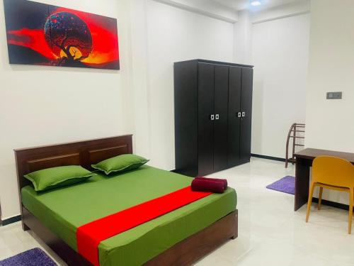 Postel nebo postele na pokoji v ubytování Hotel Ceylonia Colombo
