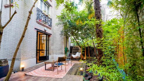 Photo de la galerie de l'établissement Luxury Jungle Loft with Private Garden, Jacuzzi & Hammam, à Paris