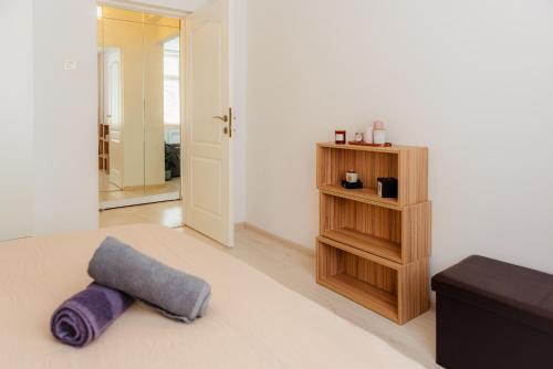 a room with a bed with a pillow on the floor at Heart of Old Town in Bucharest