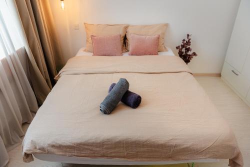 a bedroom with a bed with two pillows at Heart of Old Town in Bucharest