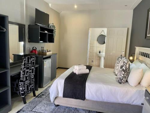 Ένα ή περισσότερα κρεβάτια σε δωμάτιο στο Fairview Guest House Hartswater