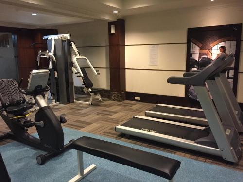 a gym with treadmills and exercise equipment in a room at Hotel Armada Petaling Jaya in Petaling Jaya