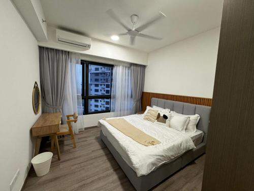 a bedroom with a large bed and a window at Agile universal service residence TRX KL in Kuala Lumpur