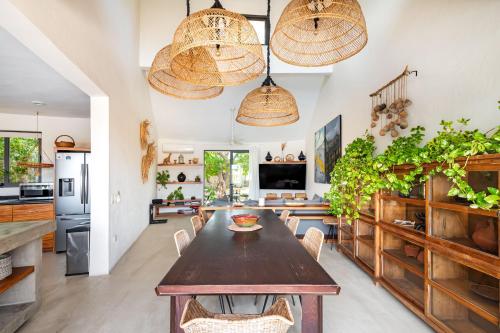 a kitchen and dining room with a table and chairs at Casa Lulú, Oasis with Pool and Panoramic Terrace in San José del Cabo
