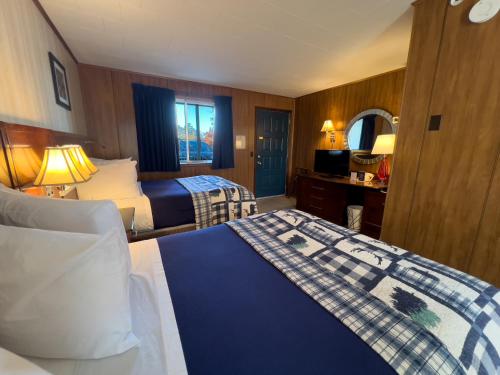 Postel nebo postele na pokoji v ubytování Riviera Motel