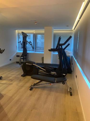a gym with two exercise bikes in a room at Hotel Distrito Oeste in Donostia-San Sebastián