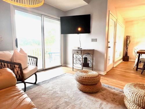 a living room with a couch and a fireplace at Top Floor Beach Retreat Tennis Courts Views 1812 in Seabrook Island