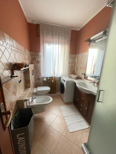 a bathroom with two sinks and a toilet and a sink at Farax's House in Saint Vincent