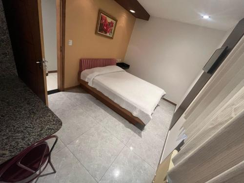 Katil atau katil-katil dalam bilik di Real Hotel
