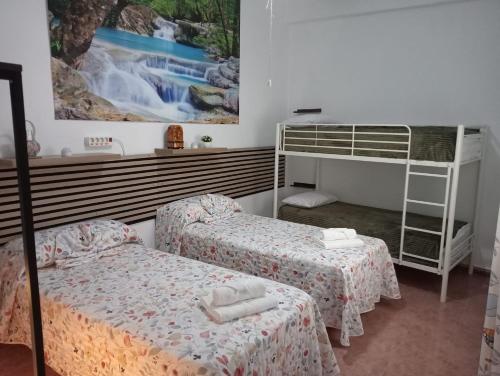 Ένα ή περισσότερα κρεβάτια σε δωμάτιο στο Alojamiento Rural Villa Rosarito