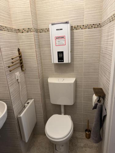 a small bathroom with a toilet and a sink at Haus mit Herz in Sulzbach-Rosenberg