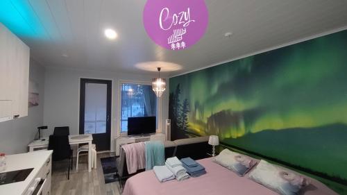 a room with a bed and a green wall at Northern Lights - Cozy apartment, sisältää liinavaatteet in Kalajoki