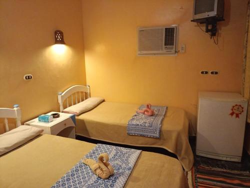 a hospital room with two beds with teddy bears on them at Oasis Panorama in Bawiti