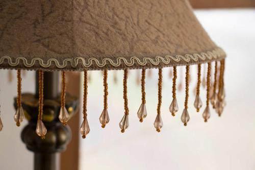 a close up of a lampshade with droplets of water on it at 1894 Catskills Farmhouse Retreat in Tannersville