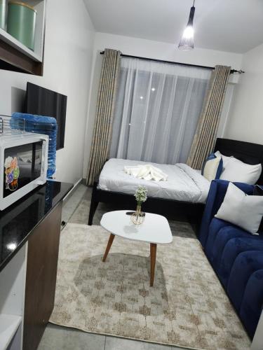 Ένα ή περισσότερα κρεβάτια σε δωμάτιο στο Comfort Haven Tsavo