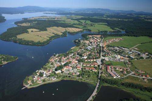 an aerial view of a town on the water at Apartments Otre Frymburk in Frymburk