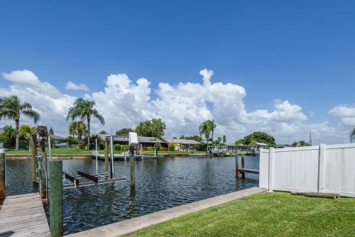 a view of a lake with a dock at Updated Waterfront Condo in Apollo Beach 1572 in Apollo Beach