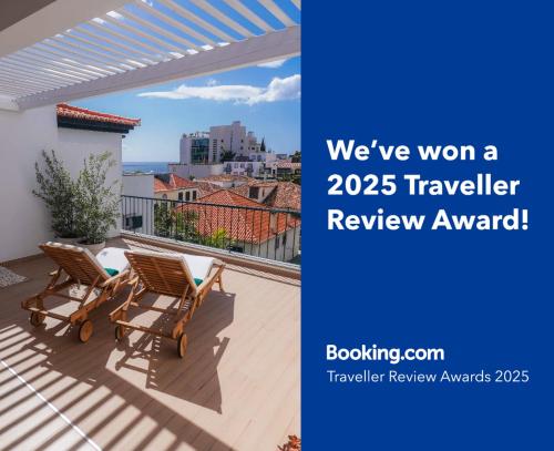 avisor picture of a patio with two chairs on a balcony at Madeira Precious Penthouse in Funchal
