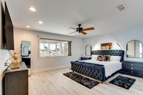 a bedroom with a bed and a ceiling fan at Waterfront Gem Crystal River Family Home in Crystal River