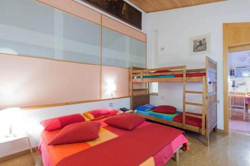 a bedroom with two beds and a bunk bed at La Casa Trasparente - locazioni brevi in Arcugnano