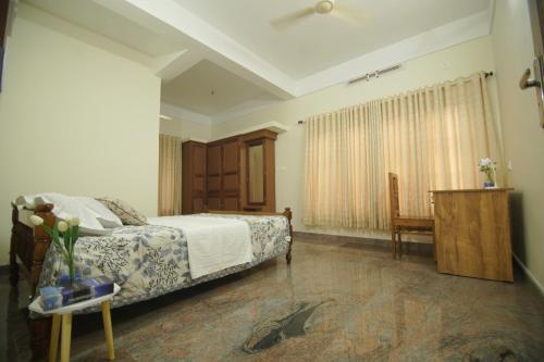 Ένα ή περισσότερα κρεβάτια σε δωμάτιο στο Prakriti Homestay