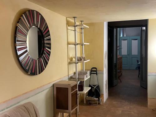 a mirror on a wall next to a room at Tre Colonne in Terni