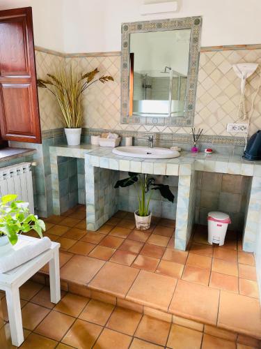 a bathroom with a sink and a mirror at Room24 Relax & Wellness in Genzano di Roma