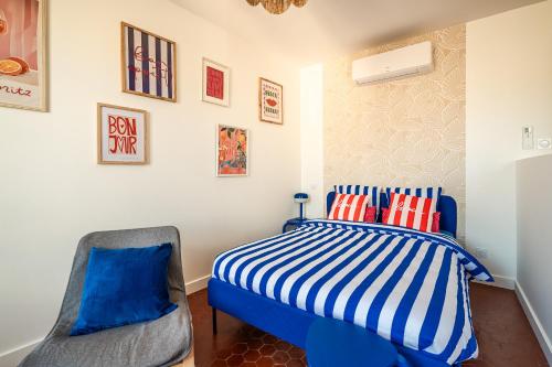 Ένα ή περισσότερα κρεβάτια σε δωμάτιο στο Studio Blue Délice
