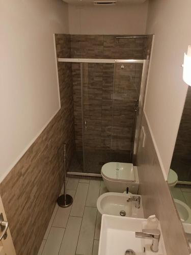a bathroom with a shower and a toilet and a sink at B&B SAN FRANCESCO Pescara Centro in Pescara
