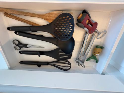 a box with a hair dryer and other kitchen utensils at SEA VIEW Juweeltje in Knokke-Heist
