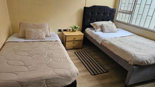 Postel nebo postele na pokoji v ubytování Colisseum Roma House - Turin- Campin Movistar Embajada cubo colsubsidio