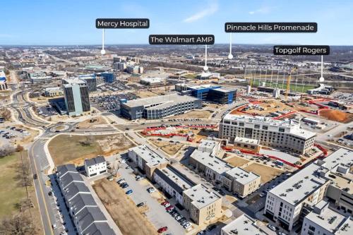 an aerial view of a city with buildings at Grand Suite Pinnacle Brownstones in Rogers