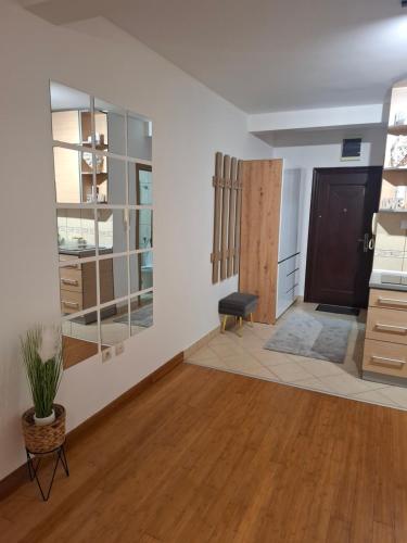 a room with white walls and wooden floors at Apartman Luka, Przno in Pržno