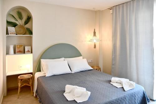 Posteľ alebo postele v izbe v ubytovaní StayBridge Apartments, Mesongi